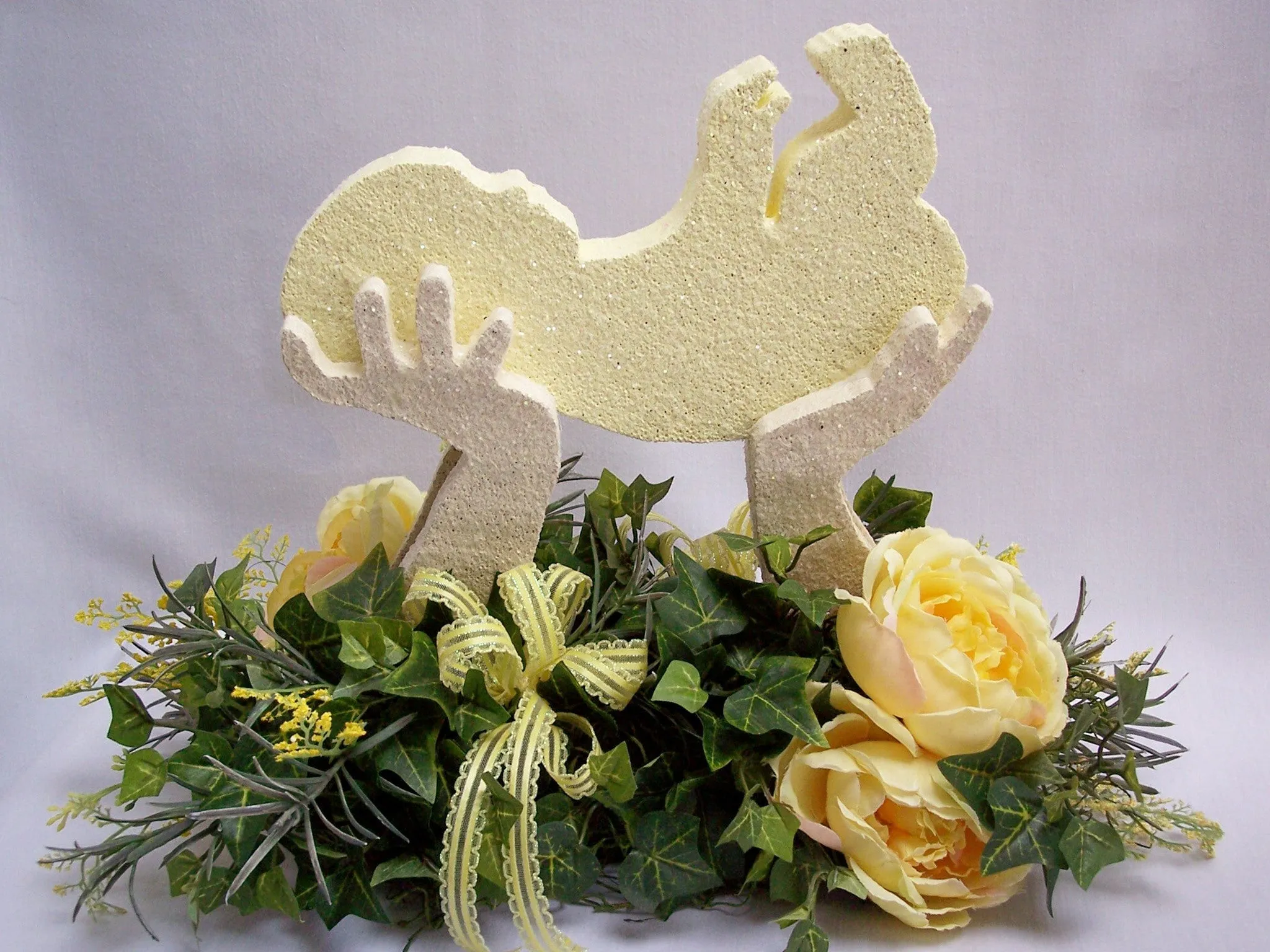 Adorable silk Baby in Hands centerpiece