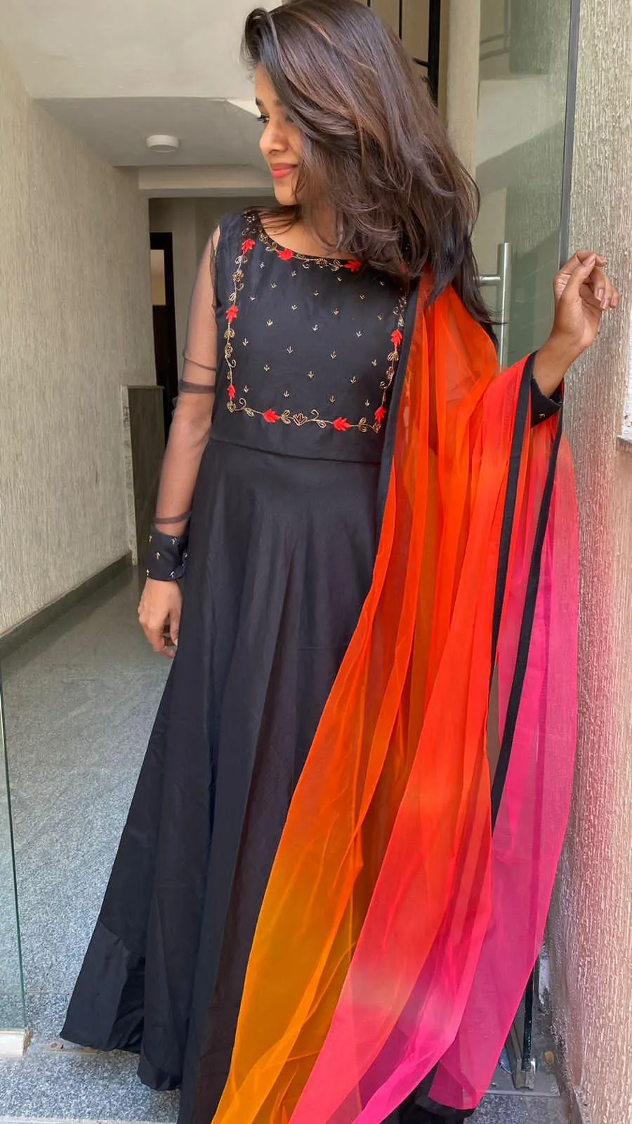 Black rose silk salwar suit of hand worked top and a red Duppata