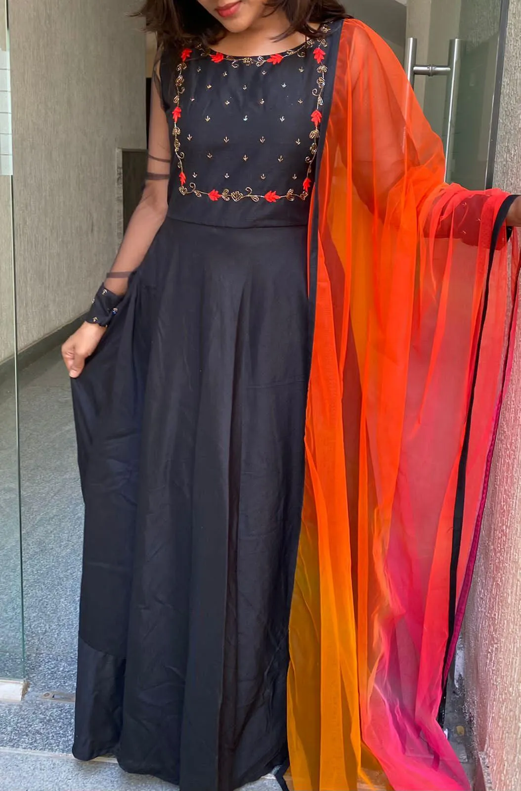 Black rose silk salwar suit of hand worked top and a red Duppata