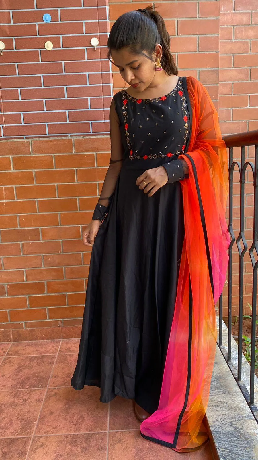 Black rose silk salwar suit of hand worked top and a red Duppata